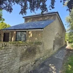 Premium La Campa natural slate roof replacement in Cambridge with new battens, lead flashings, and dry-ridge system.